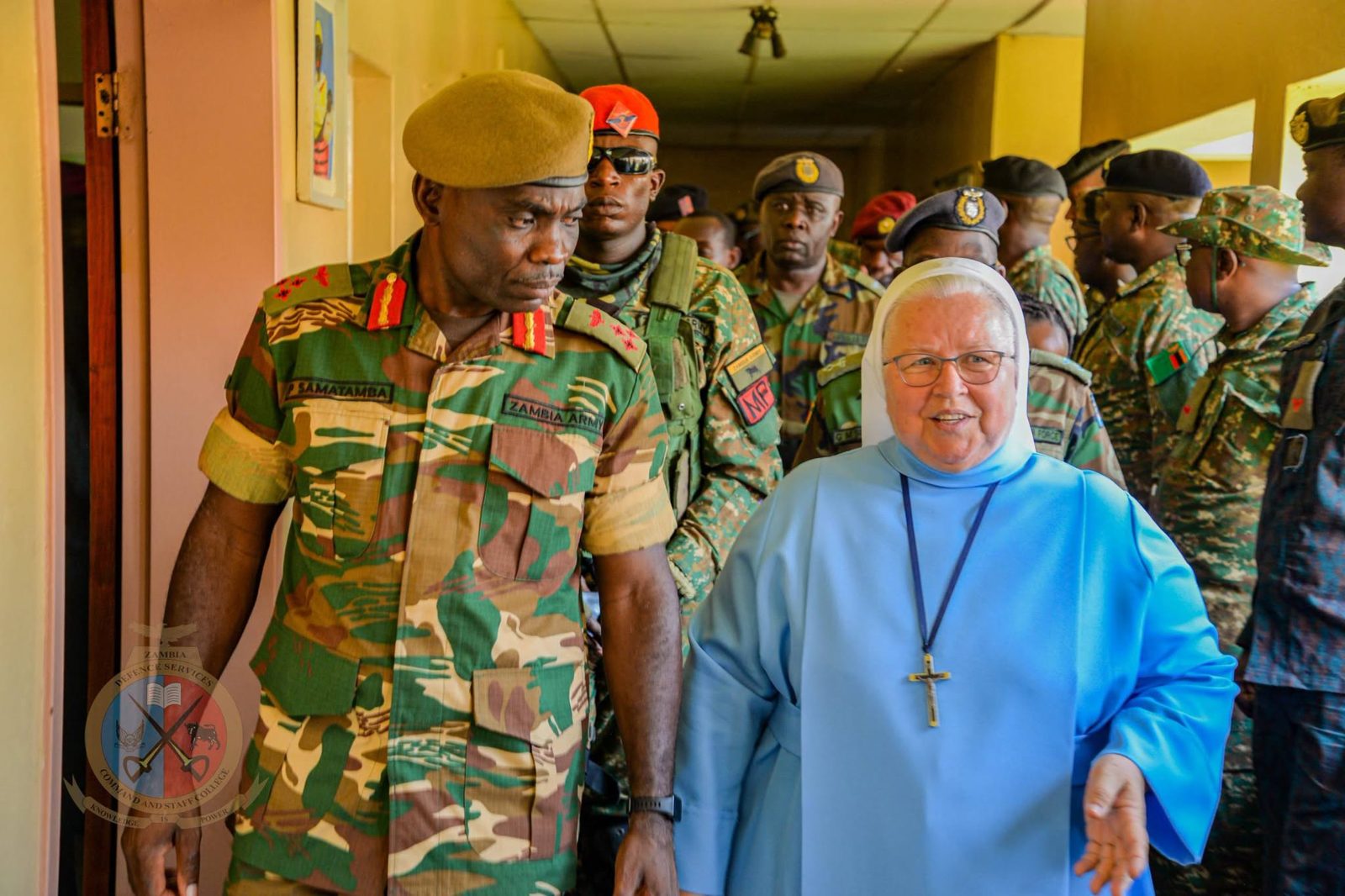 The Commandant walking with Sister Mariola